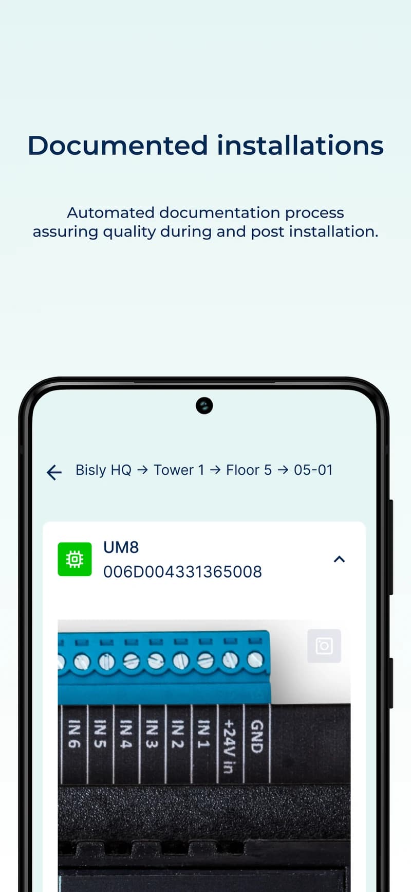 Bisly Installer app documenting a completed building automation installation with a device photograph