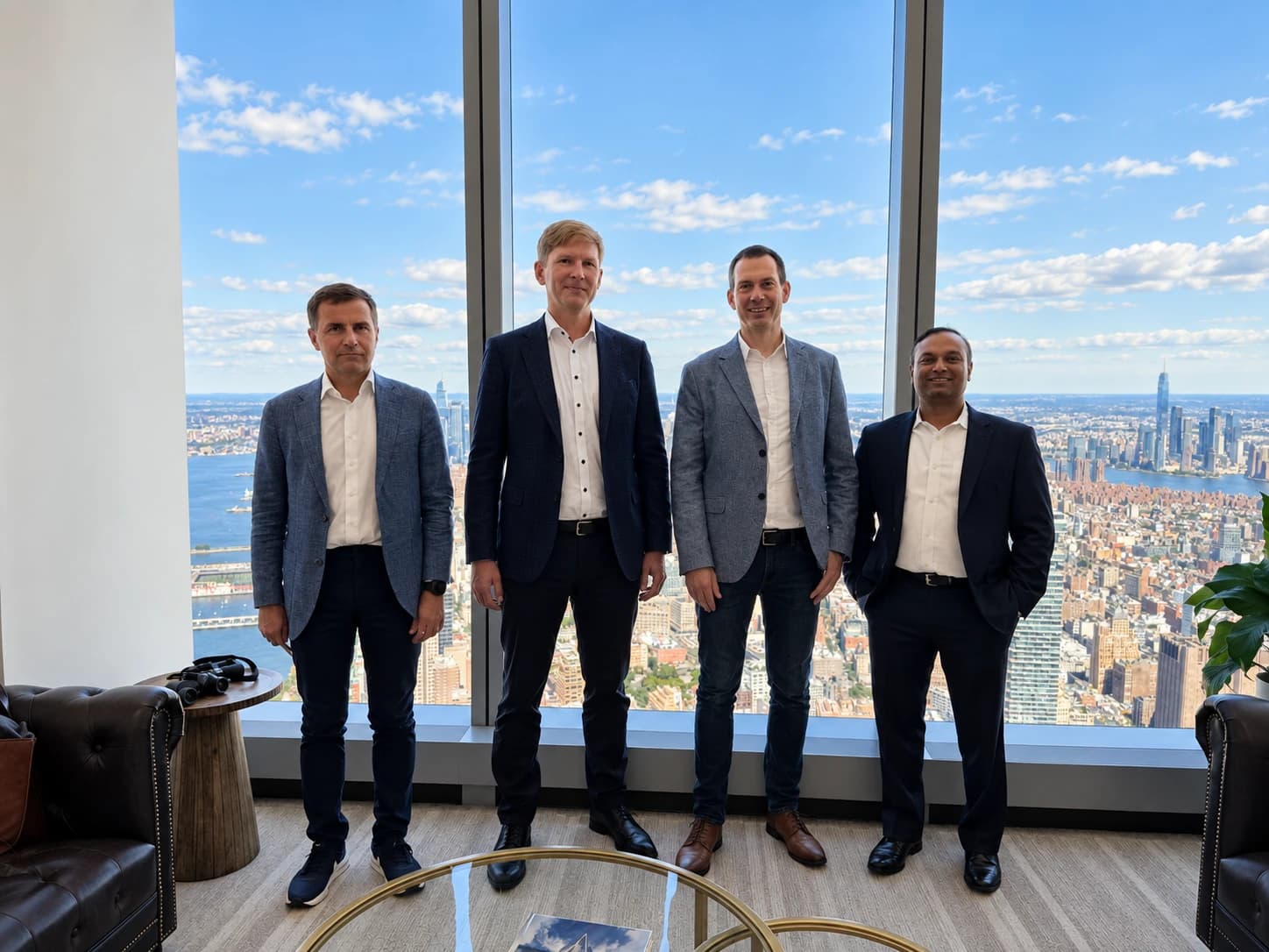 Four representatives at the IBIS and Bisly partnership meeting overlooking New York City